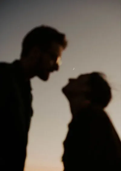 Soft focus couple silhouette at dusk