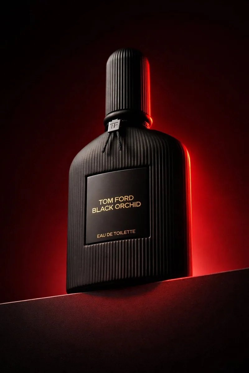 Luxury product photography of a black ribbed glass bottle